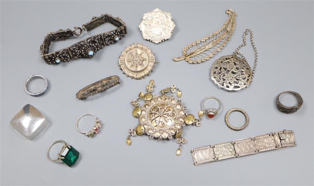 Mixed jewellery including silver brooch and white metal bracelets.